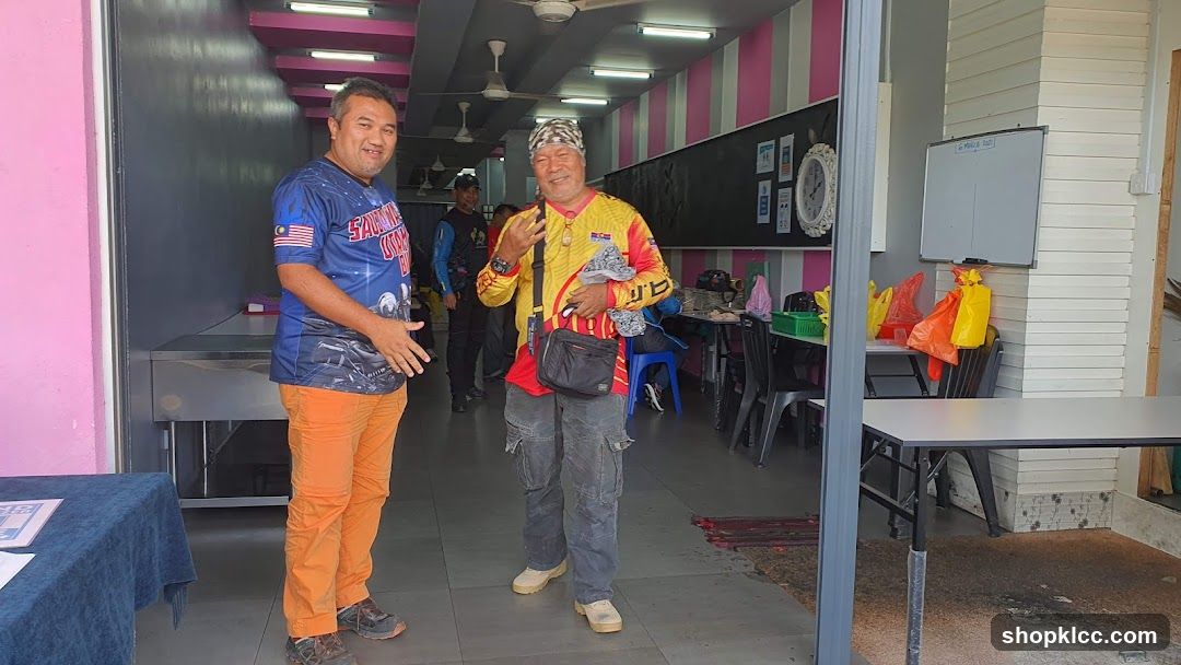 Two men standing in a shop