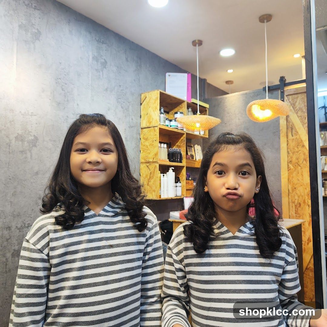 Two girls in striped hoodies