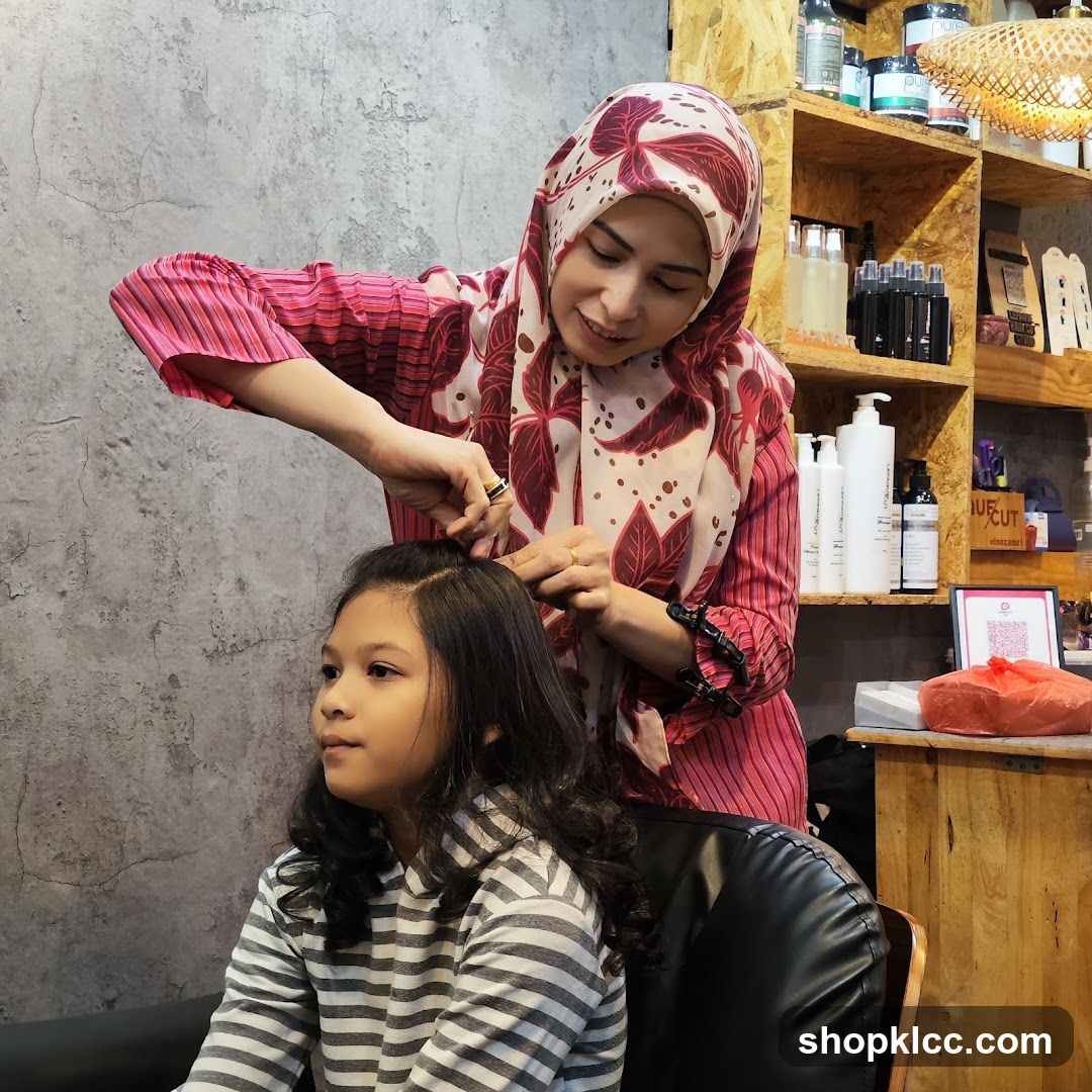 Hairdresser styling a child's hair