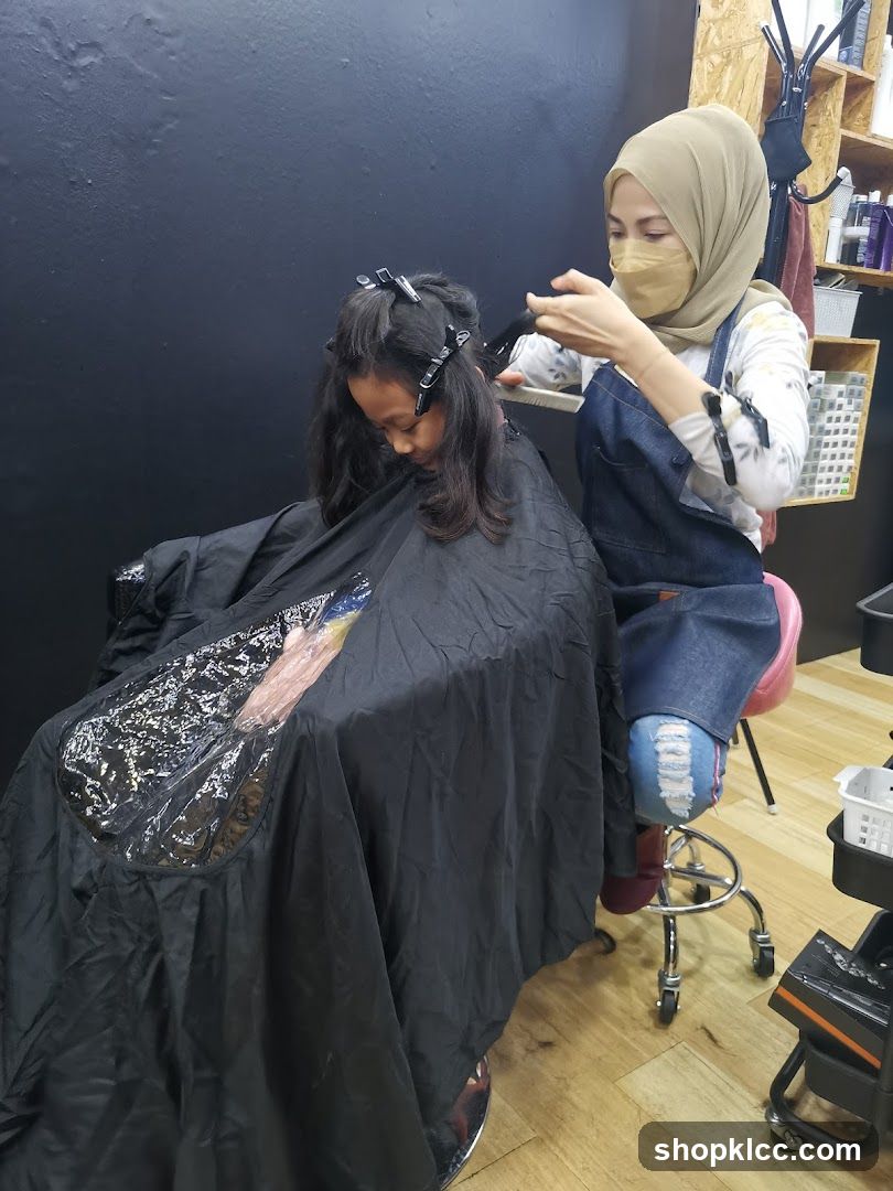 Hairdresser cutting a child's hair