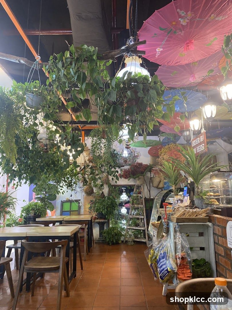 Cafe Interior with Hanging Plants and Umbrellas