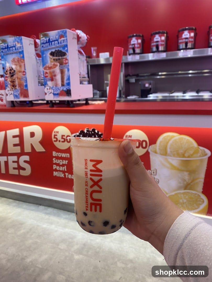 Person holding a bubble tea drink