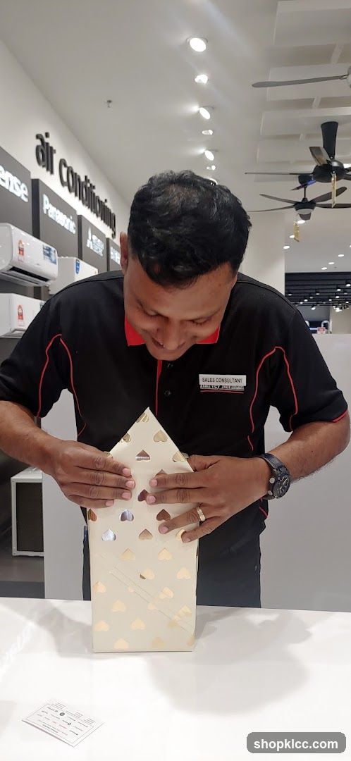 Sales consultant wrapping a gift