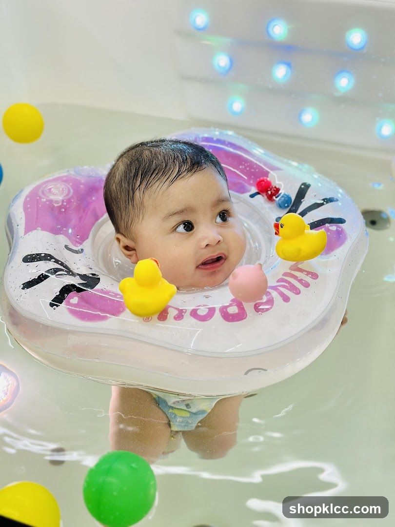 Baby in a bathtub with a swim ring