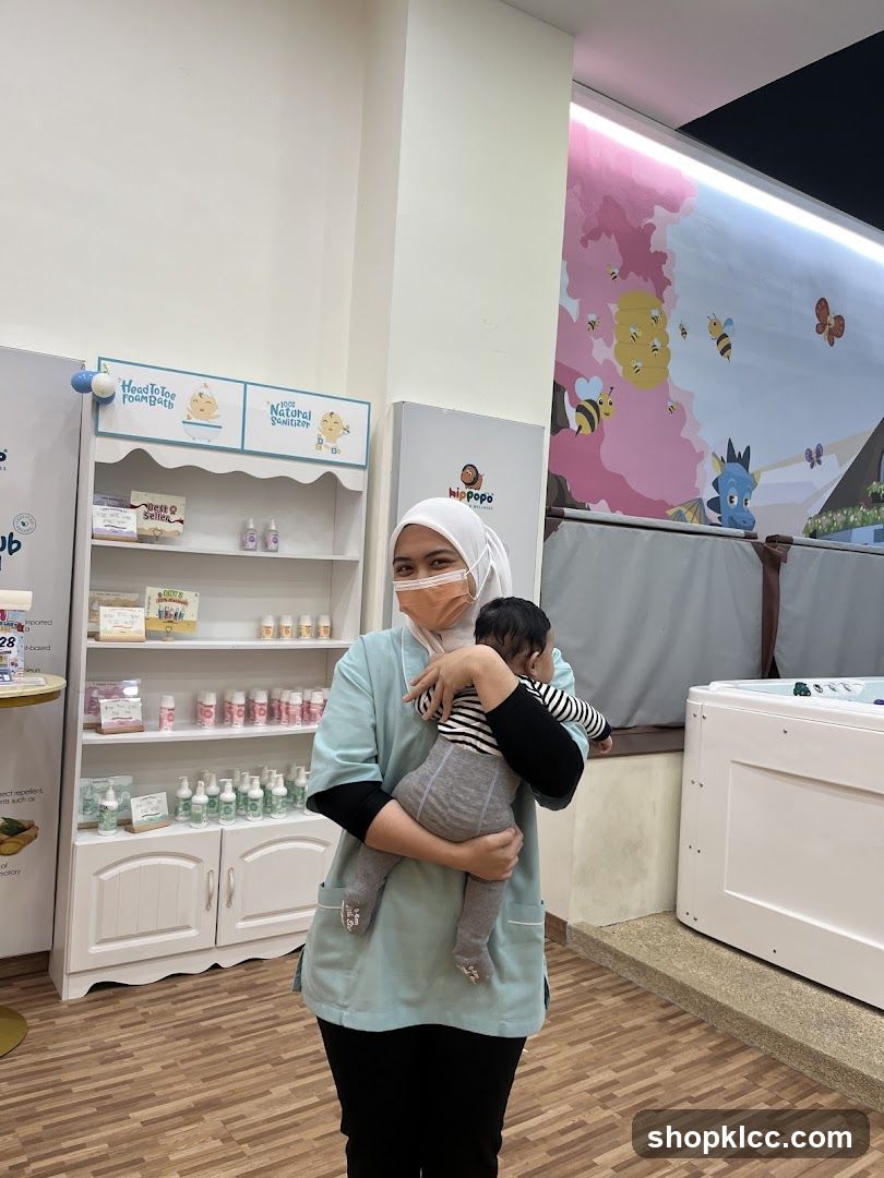 Staff member holding a baby