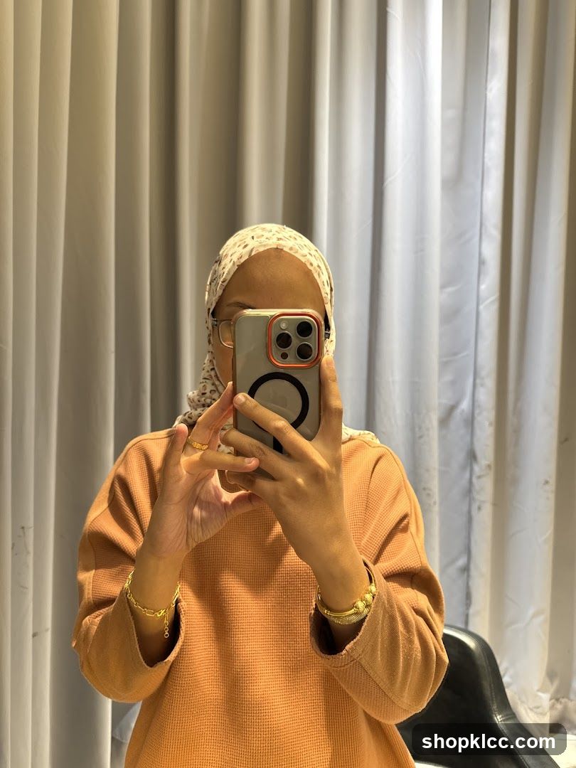 Woman taking a mirror selfie