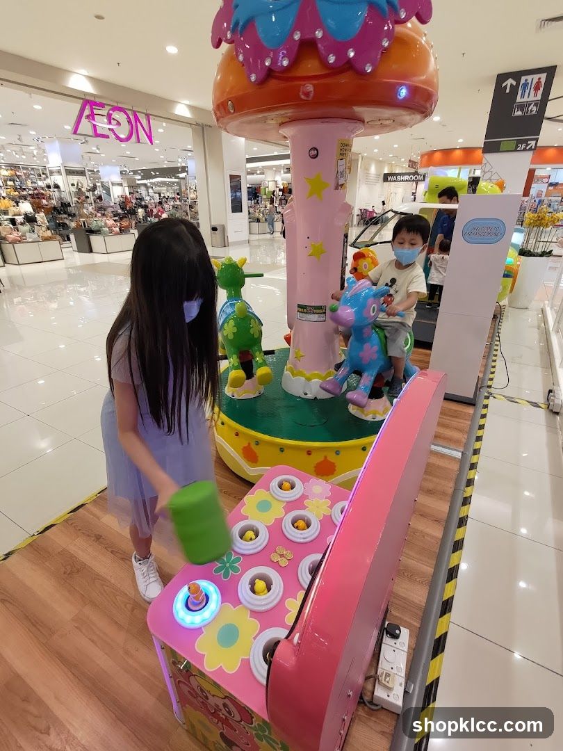 Children Playing at an Arcade Game
