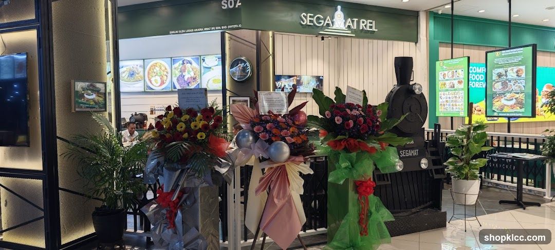 Restaurant Entrance with Floral Arrangements and Train Decor