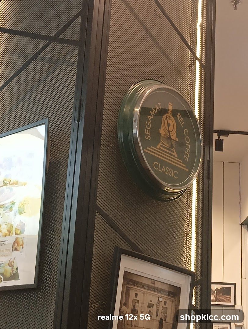 Coffee shop interior with clock and artwork