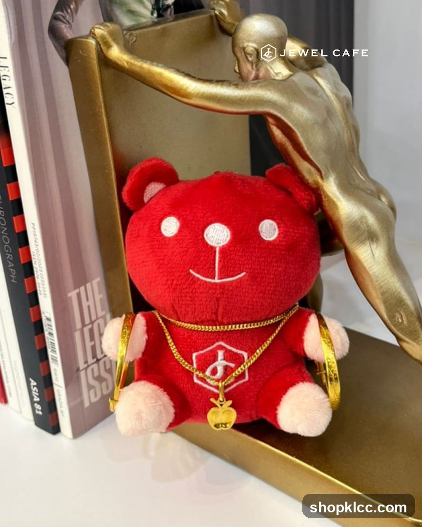 Red teddy bear with gold jewelry and books