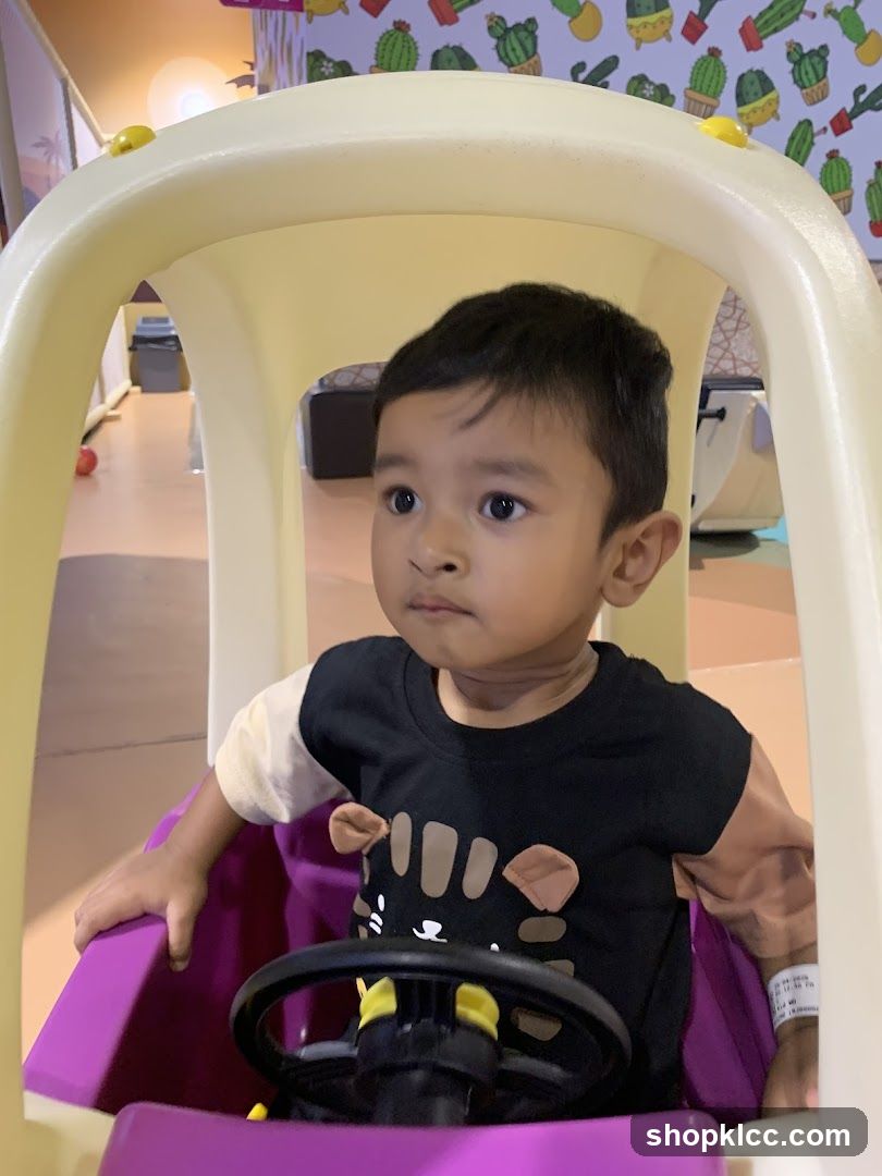 Child in a Toy Car