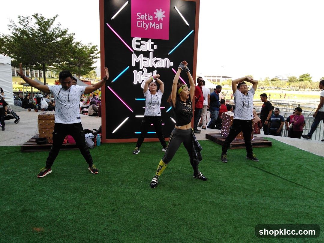 People exercising in front of a mall advertisement