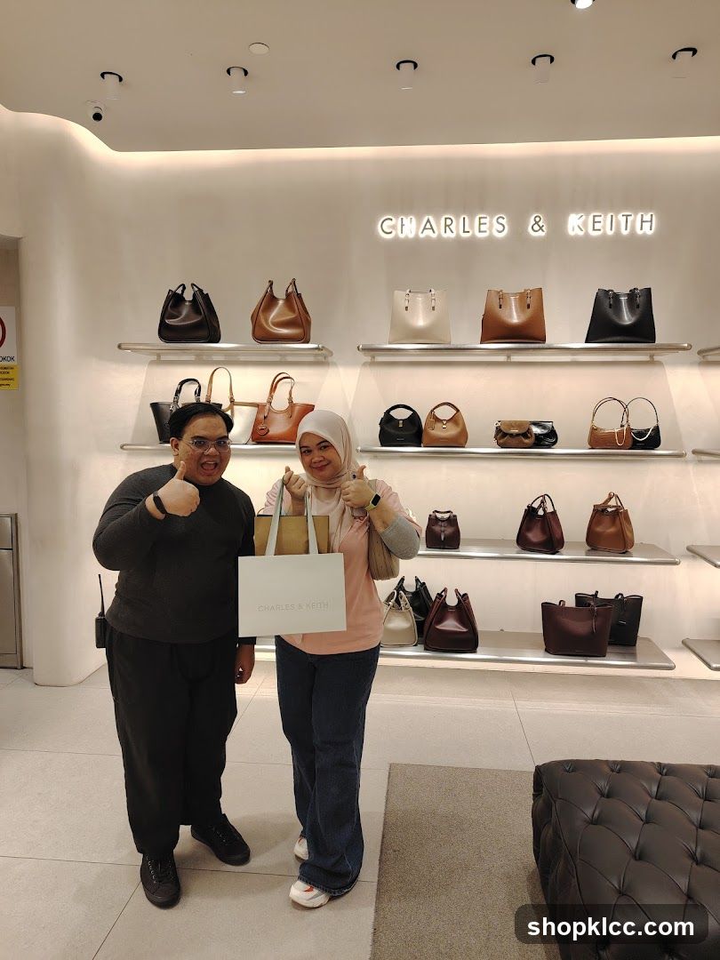 Two people posing in a Charles & Keith store