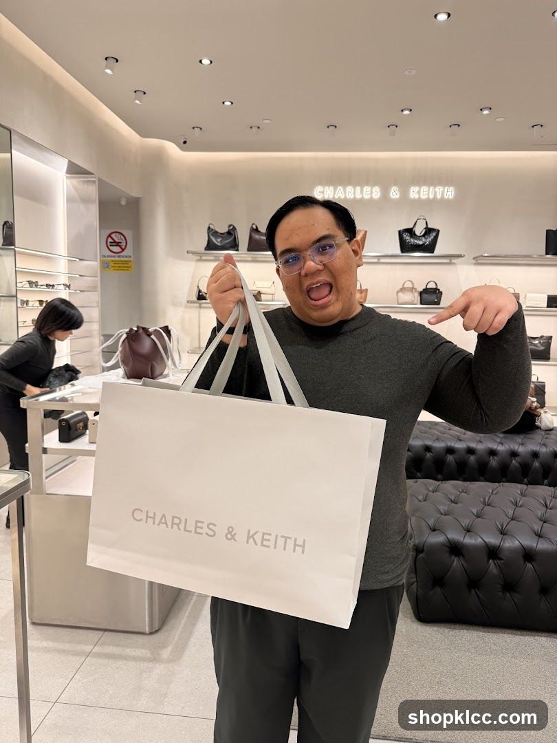 Man holding a shopping bag in a store