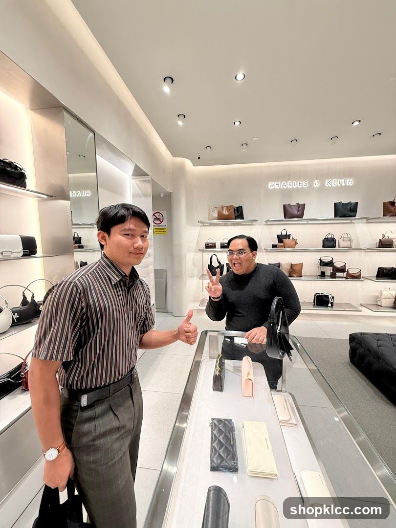 Two men in a handbag store