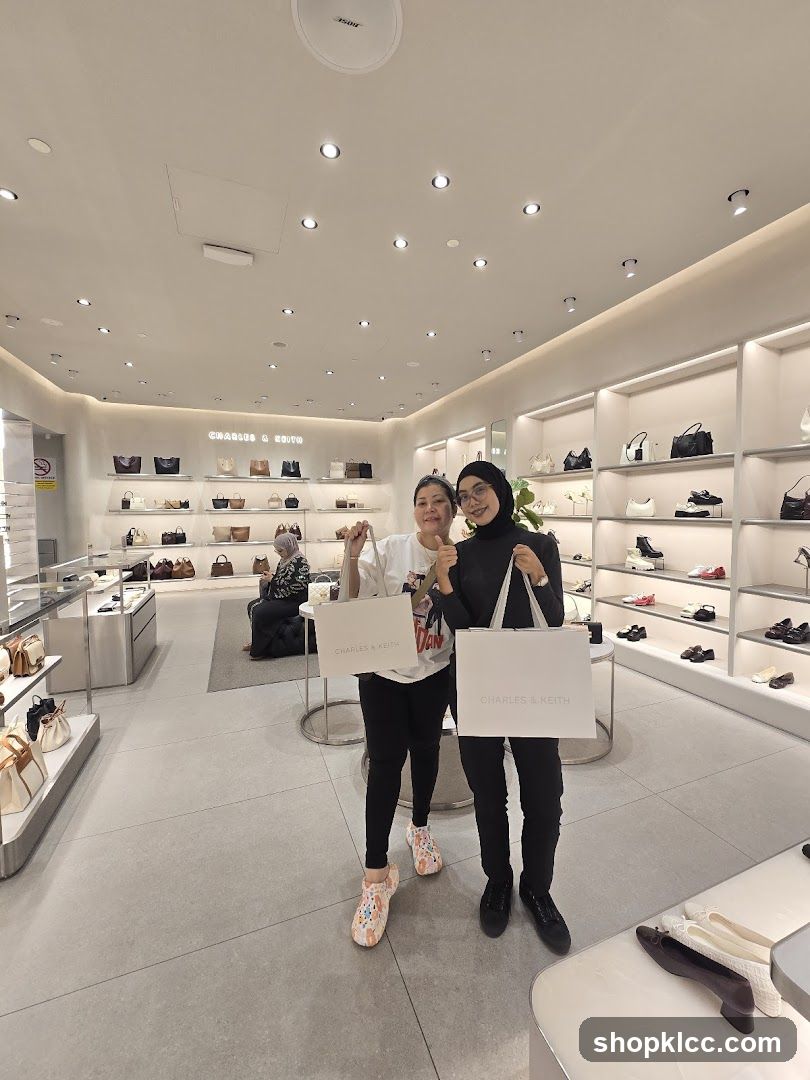Two women holding shopping bags in a store