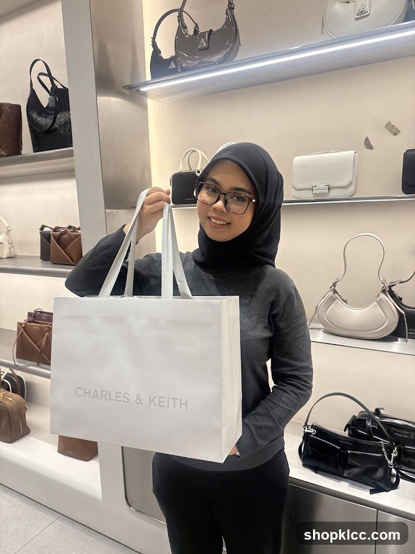 Woman Holding a Charles & Keith Shopping Bag
