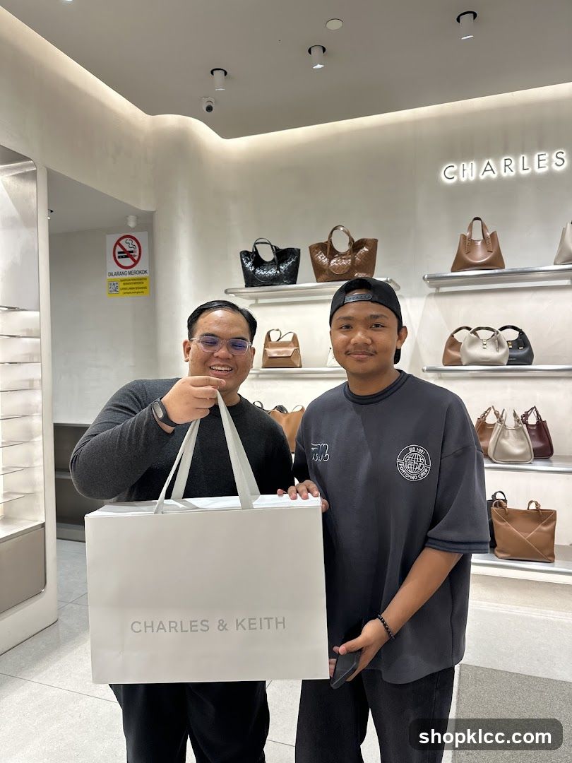 Two people holding a shopping bag