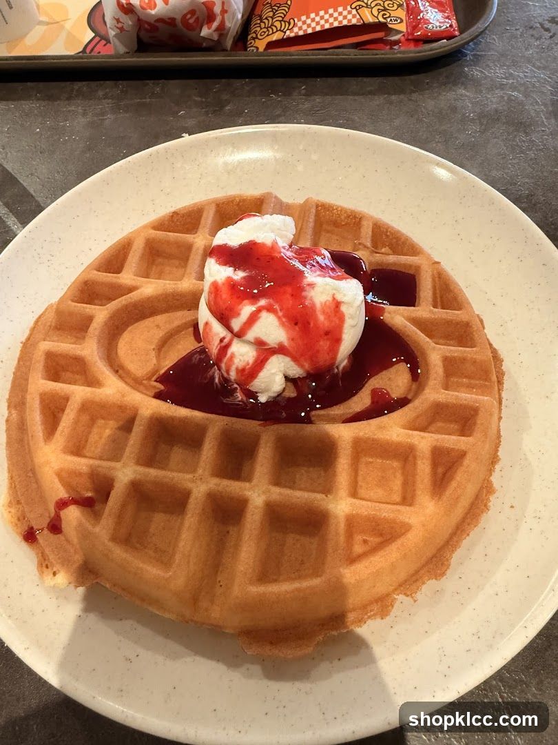 Waffle with Ice Cream and Berry Sauce