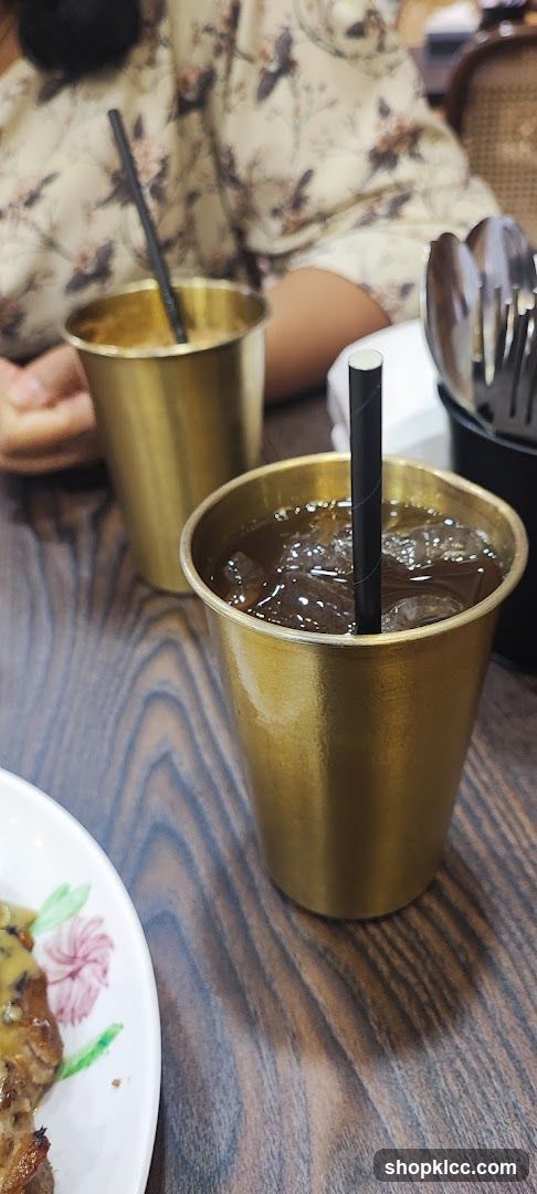 Two golden cups with drinks