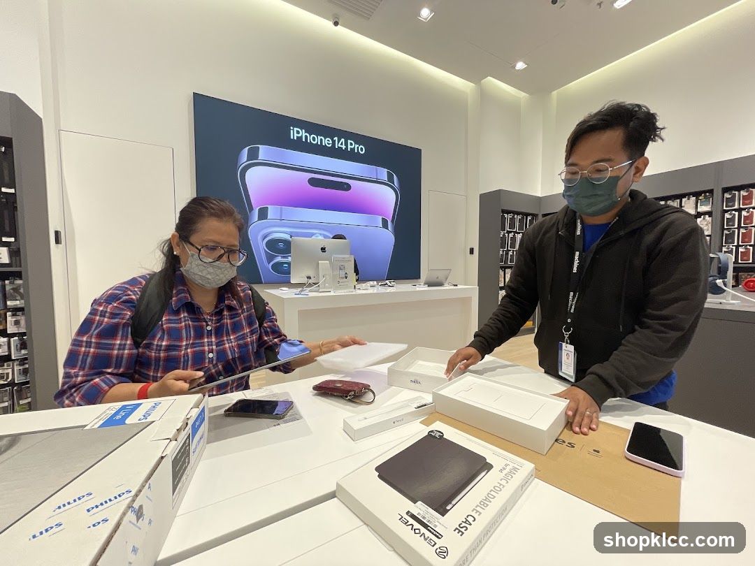 Customers examining products in an electronics store
