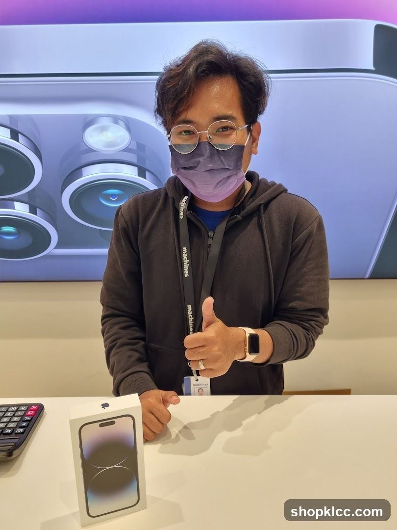 Man with iPhone box