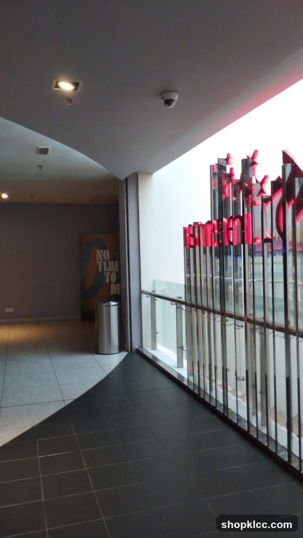 Interior hallway with movie poster and illuminated signage