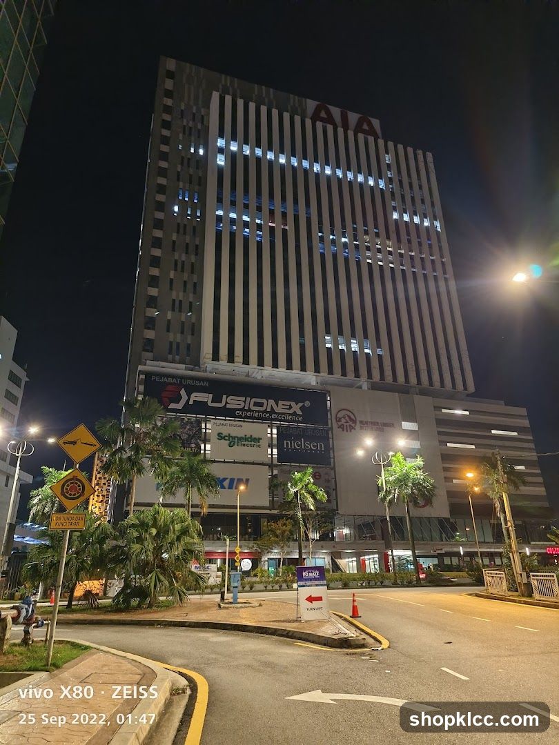 Night view of a modern office building with signage