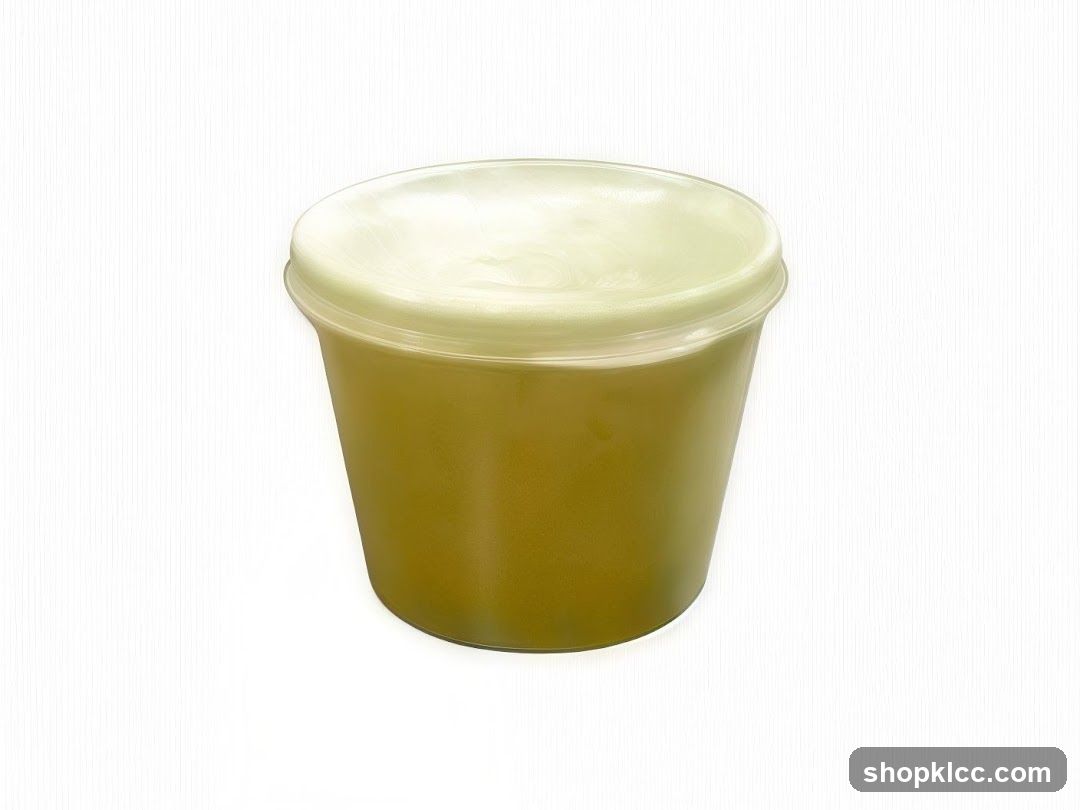Green beverage in a plastic cup