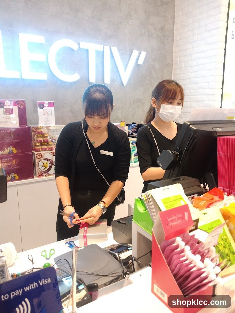 Staff wrapping a gift at a counter