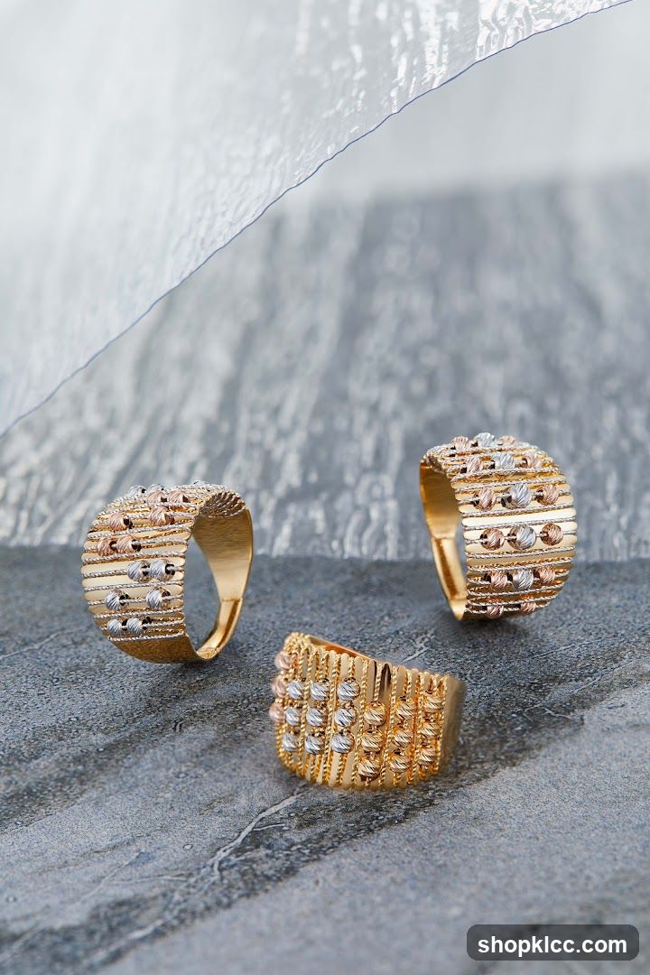 Three gold rings with beaded details