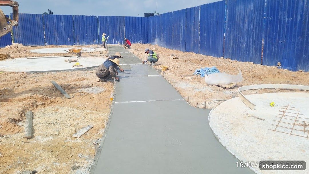 Construction workers pouring concrete