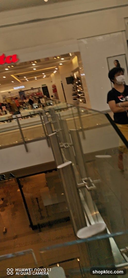Interior of a shopping mall with a store visible