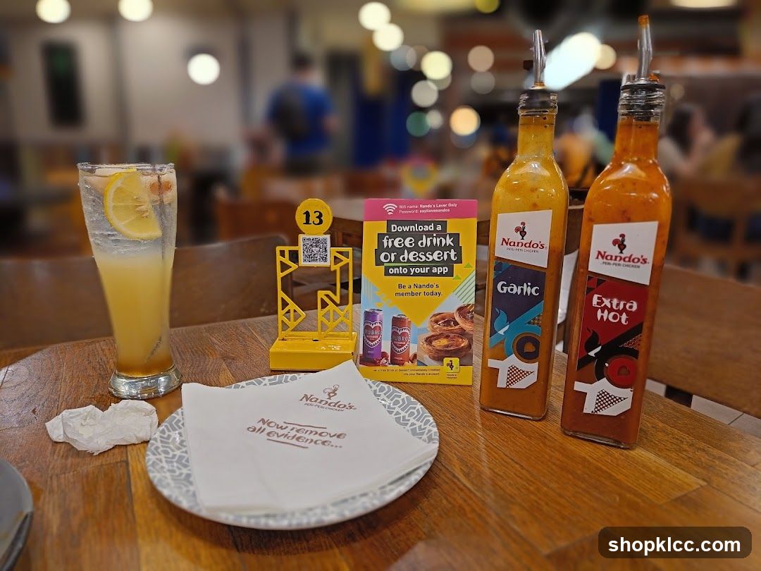Nando's Table Setting with Condiments and Drink