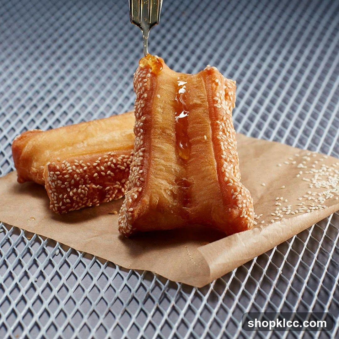 Fried Dough Sticks with Sesame Seeds and Honey