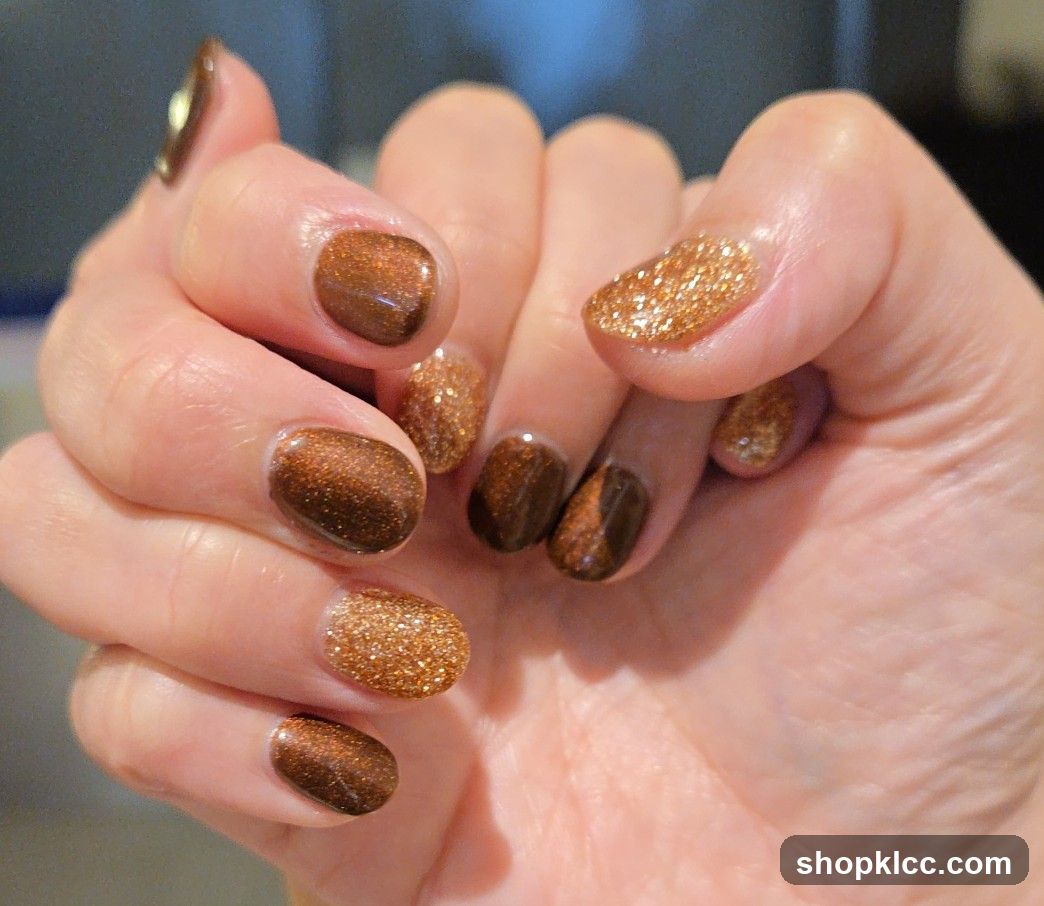 Nails with brown and gold glitter polish