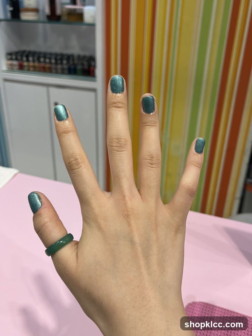 Hand with Teal Nail Polish