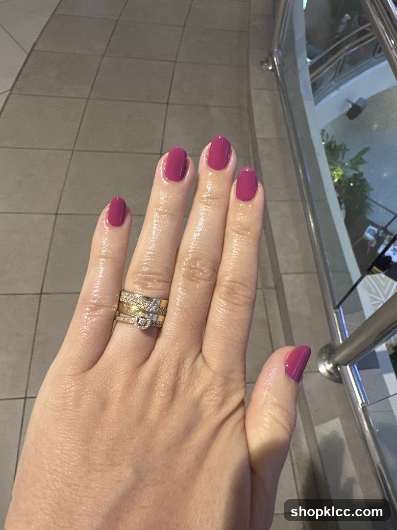 Hand with manicured nails and rings