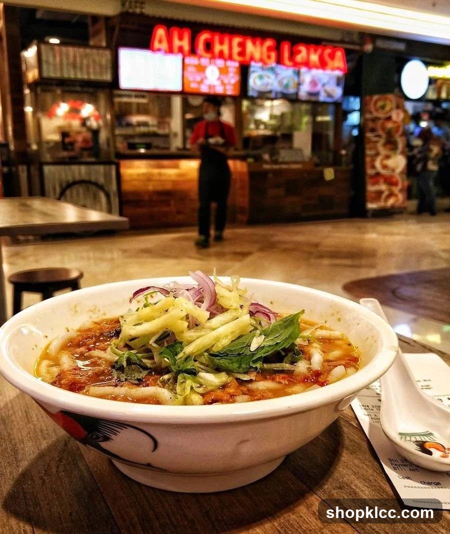 Bowl of Laksa with Restaurant in Background