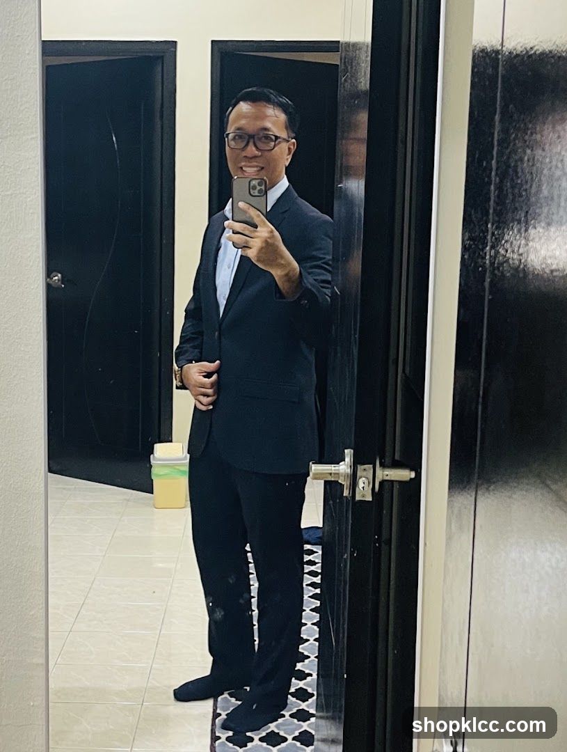 Man in Suit Taking Mirror Selfie