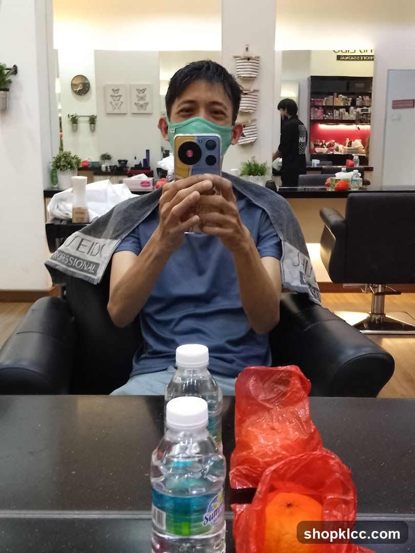 Man taking a selfie in a salon