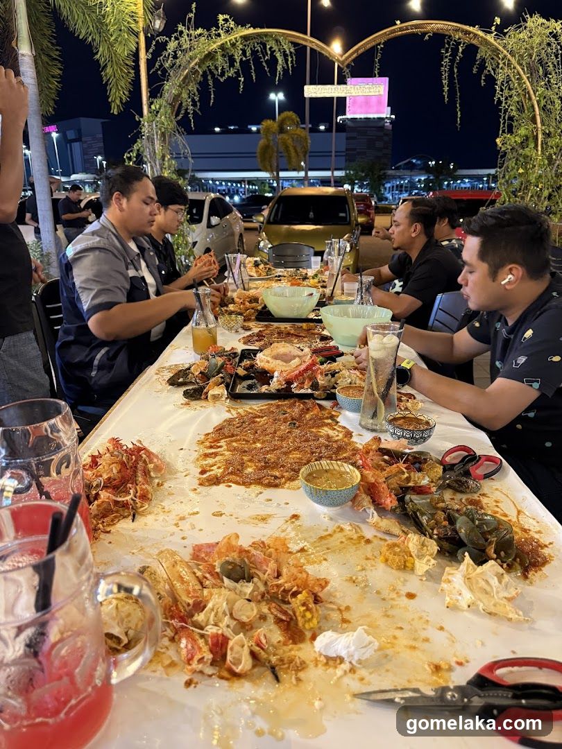 Group dining at outdoor seafood restaurant