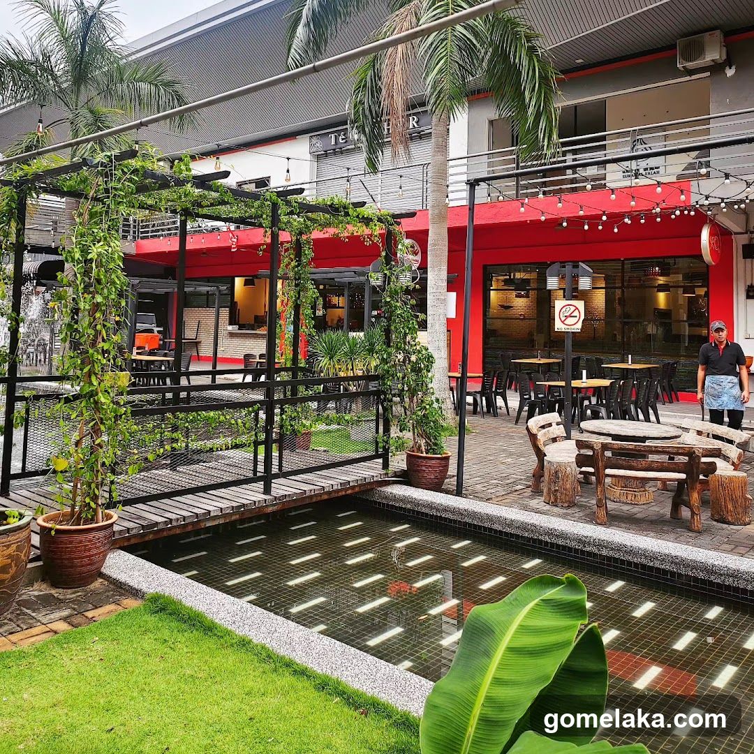Outdoor dining area with red storefront
