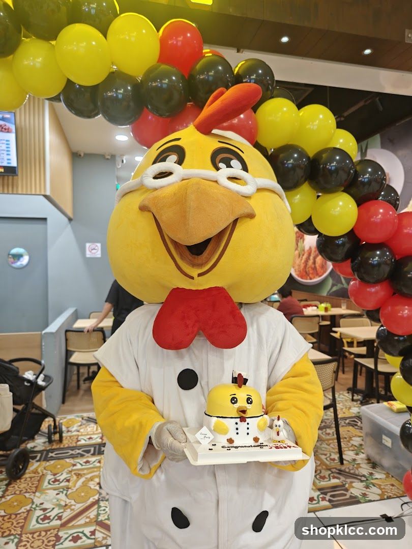 Mascot holding a cake