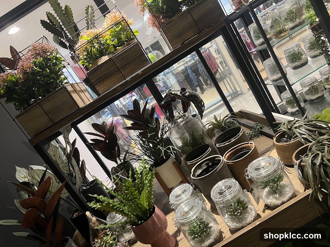 Assortment of artificial plants and decorative jars
