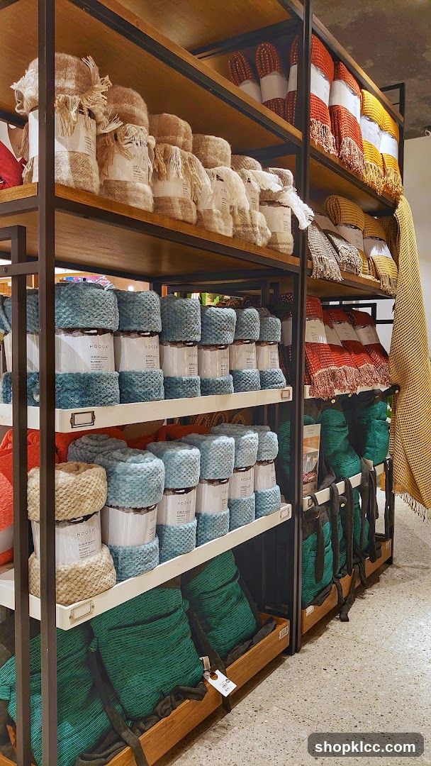 Shelves stocked with blankets and throws