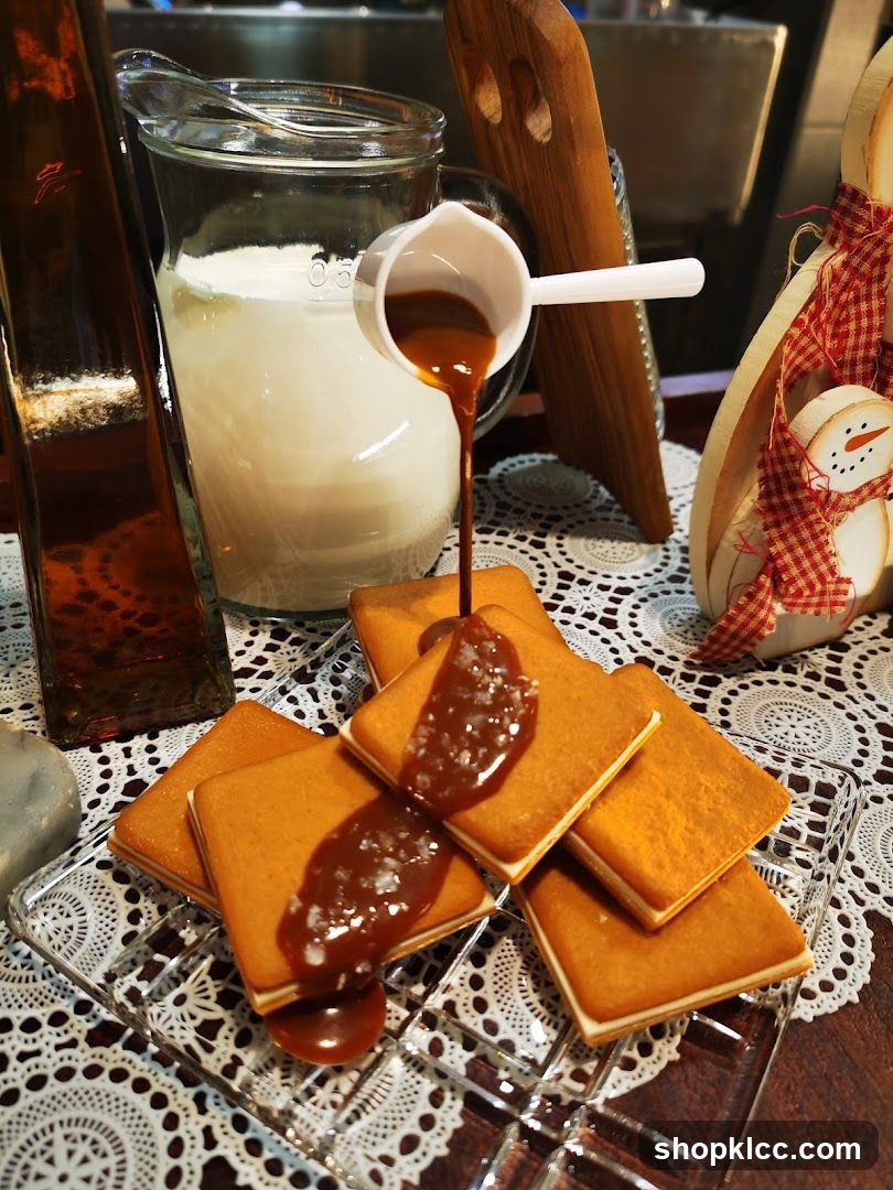 Caramel being poured over cookies