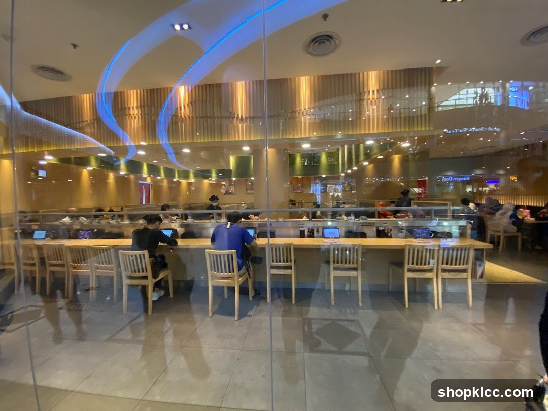 Interior of a restaurant with patrons seated at a counter