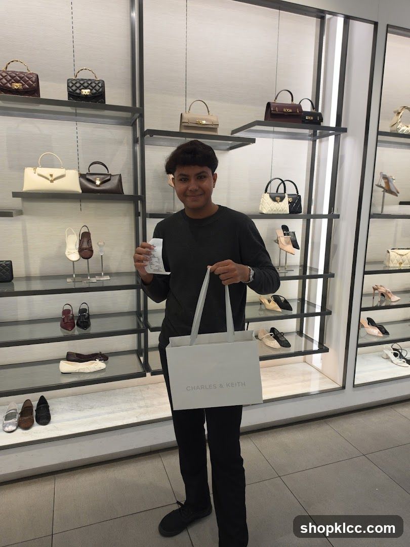 Man holding a shopping bag and receipt in a store