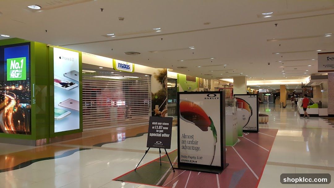Mall Interior with Storefronts and Advertisements